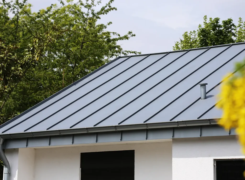 dark metal roof installed on white home taylorville illinois
